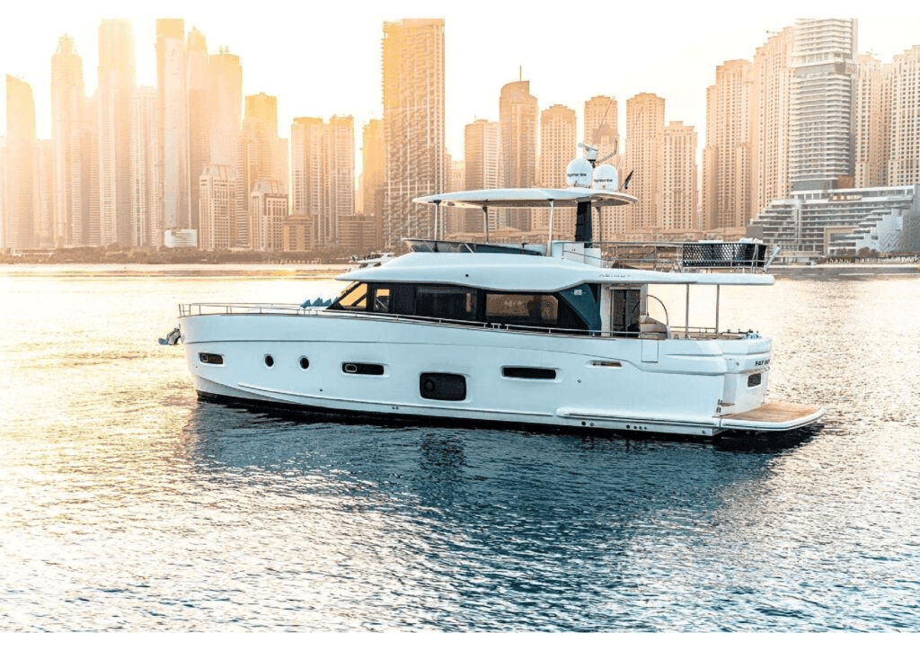 Luxury yacht cruising past Dubai Marina skyline at golden hour for a private proposal experience